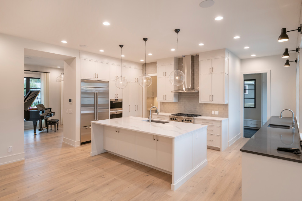 Example of a transitional kitchen design in Calgary