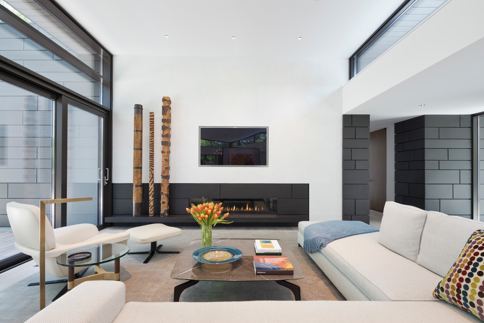 Living room - large contemporary open concept gray floor and light wood floor living room idea in New York with white walls, a ribbon fireplace, a stone fireplace and a media wall