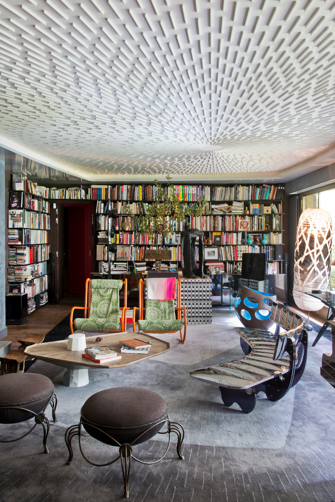 Photo of a large eclectic enclosed living room in Paris with a library, no fireplace and no tv.
