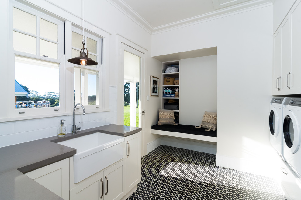 This is an example of a transitional laundry room in Sydney.