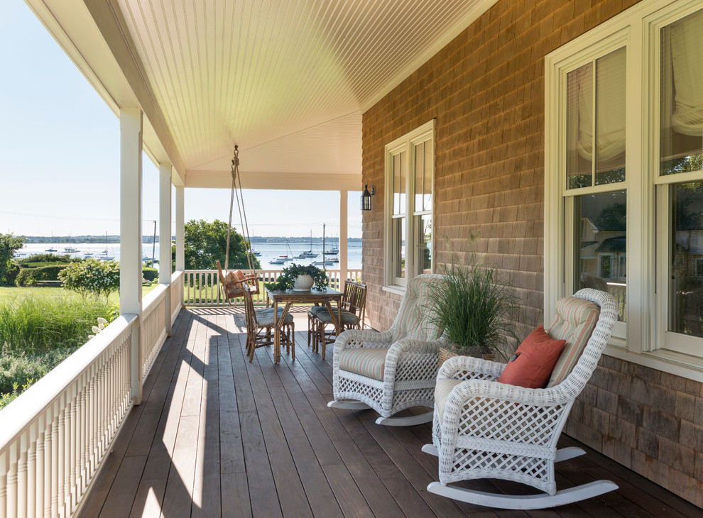 Design ideas for a beach style verandah in Providence with a container garden, decking and a roof extension.
