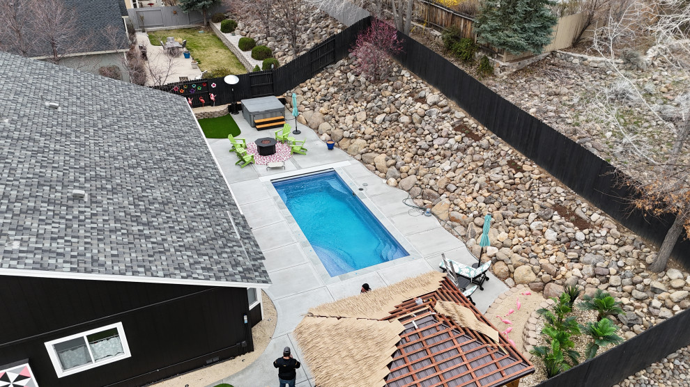 Pool landscaping - backyard brick and rectangular pool landscaping idea