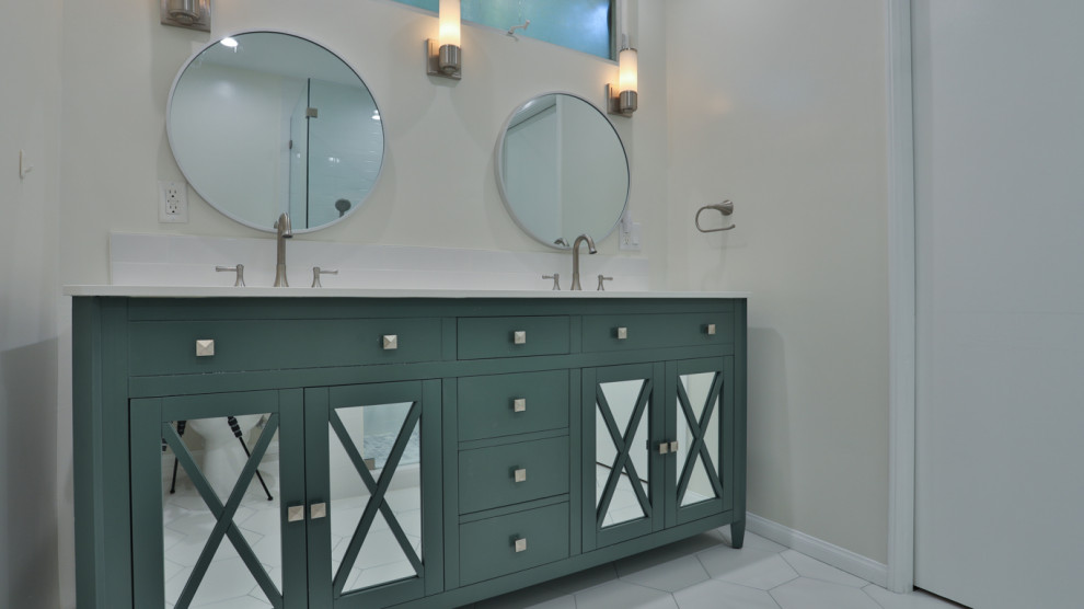 Mid-sized minimalist master white tile and ceramic tile mosaic tile floor, white floor, double-sink and wainscoting bathroom photo in Los Angeles with shaker cabinets, green cabinets, beige walls, a drop-in sink, marble countertops, white countertops and a built-in vanity
