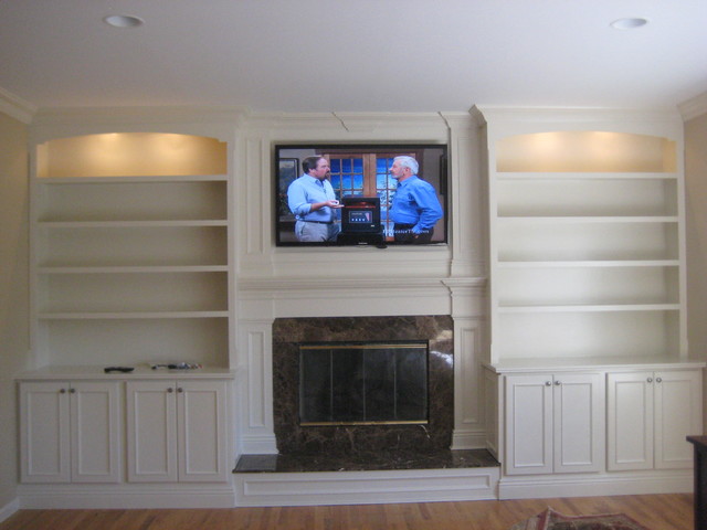 custom built mantle, cabinets and bookshelves - traditional - living
