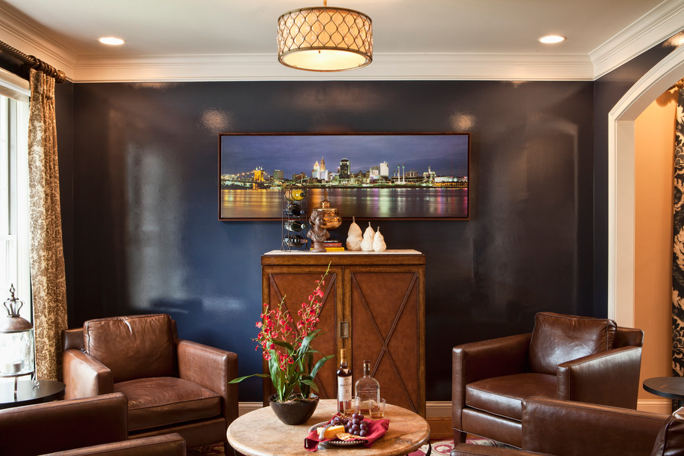 This is an example of a contemporary enclosed family room in Cincinnati with black walls.