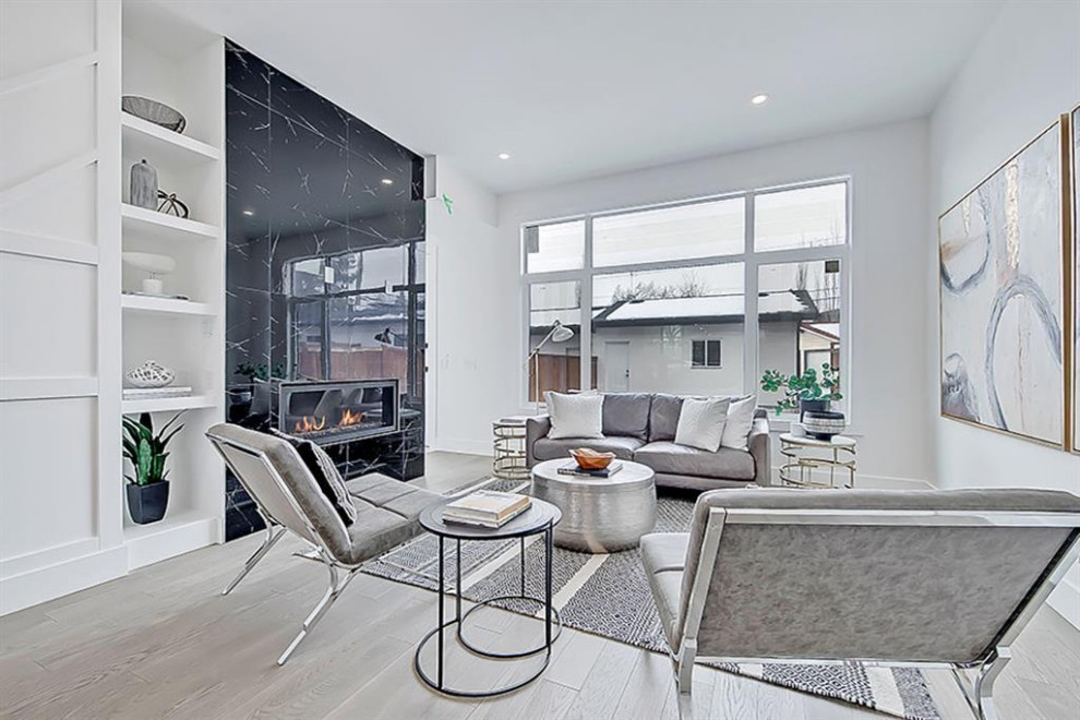 Example of a transitional home design design in Calgary