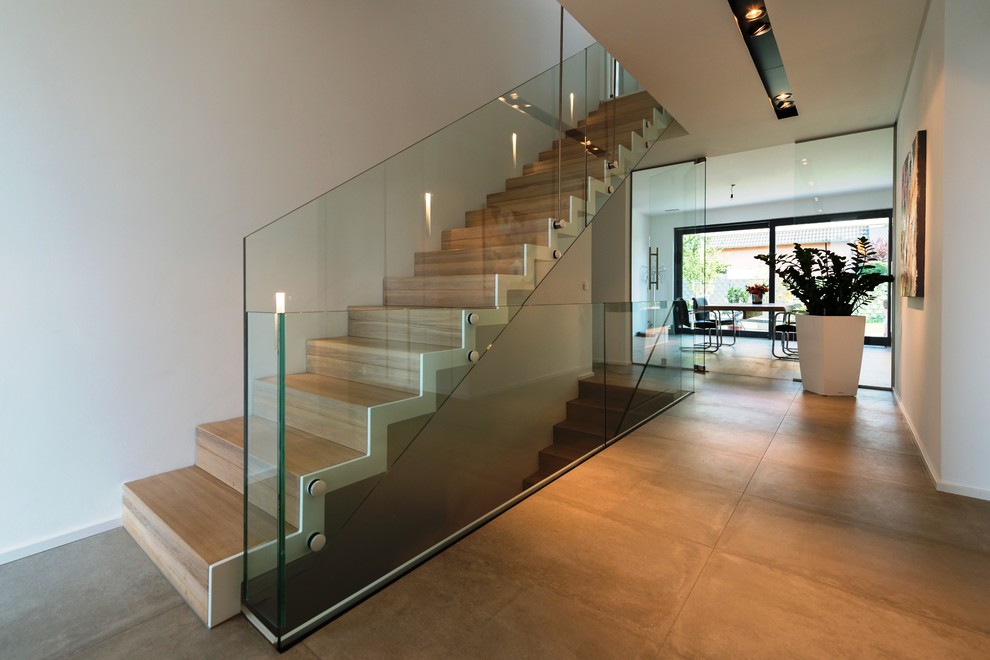 This is an example of a large contemporary wood straight staircase in Other with wood risers.