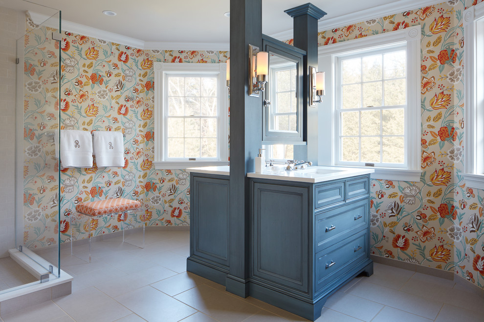 Inspiration for a traditional master bathroom in Boston with blue cabinets, multi-coloured walls, an undermount sink, beige floor, white benchtops and recessed-panel cabinets.