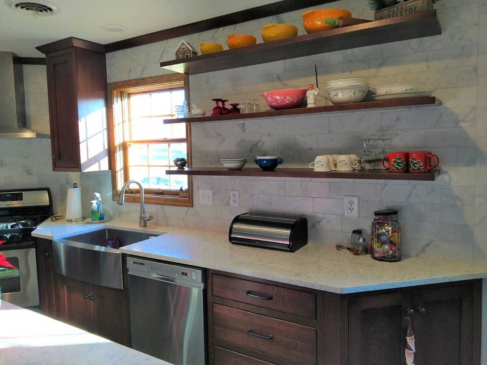 Kitchen - mid-sized transitional l-shaped kitchen idea with a farmhouse sink, flat-panel cabinets, medium tone wood cabinets, quartz countertops, multicolored backsplash, ceramic backsplash, stainless steel appliances and an island