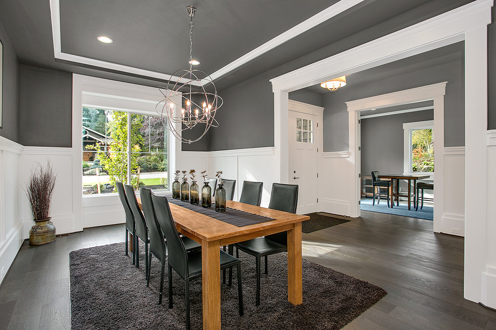 Photo of a transitional dining room in Seattle with grey walls and dark hardwood floors.