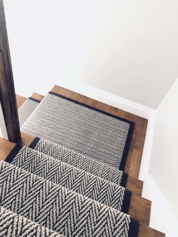 Inspiration for a transitional wooden l-shaped wood railing staircase remodel in Toronto with painted risers