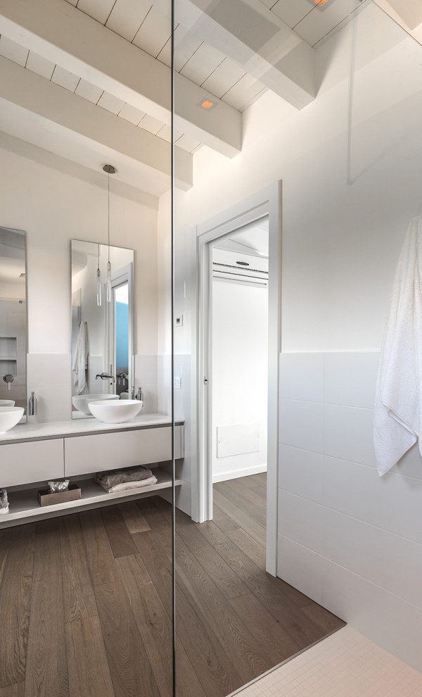 Mid-sized beach style master bathroom in Milan with flat-panel cabinets, white cabinets, white walls, dark hardwood floors, a vessel sink, laminate benchtops, multi-coloured floor, white benchtops, a double vanity, a floating vanity and exposed beam.