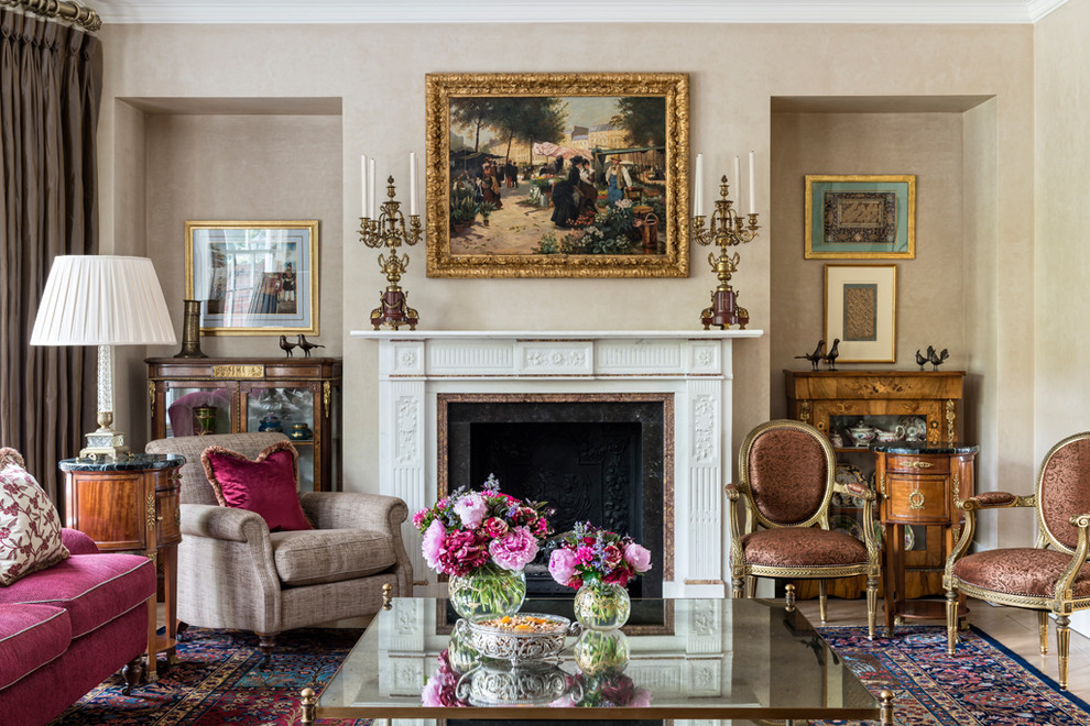 Inspiration for a traditional formal enclosed living room in London with beige walls, carpet, a standard fireplace, a wood fireplace surround and no tv.