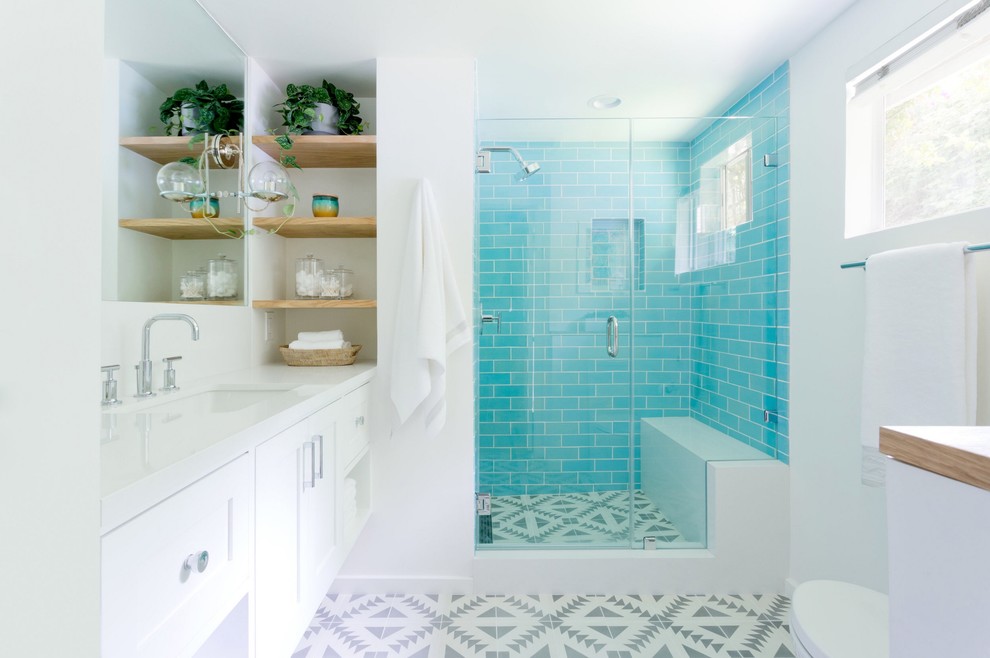 Mid-sized contemporary master bathroom in Los Angeles with blue tile, ceramic tile, shaker cabinets, white cabinets, white walls, an undermount sink, multi-coloured floor and a hinged shower door.