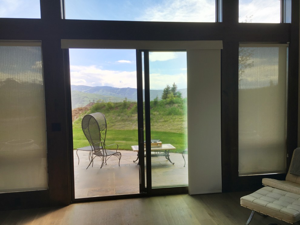 Sliding solar roller shade panels on patio door in Avon Colorado