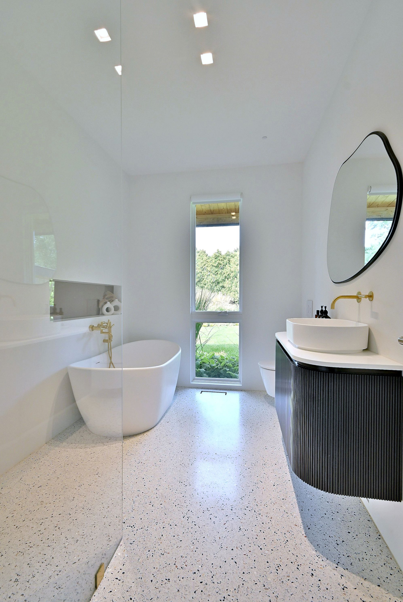 Mid-Century Modern Bathroom with Freestanding Tub