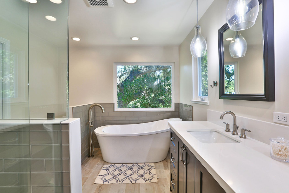 Design ideas for a traditional bathroom in San Francisco with a freestanding bath and double sinks.
