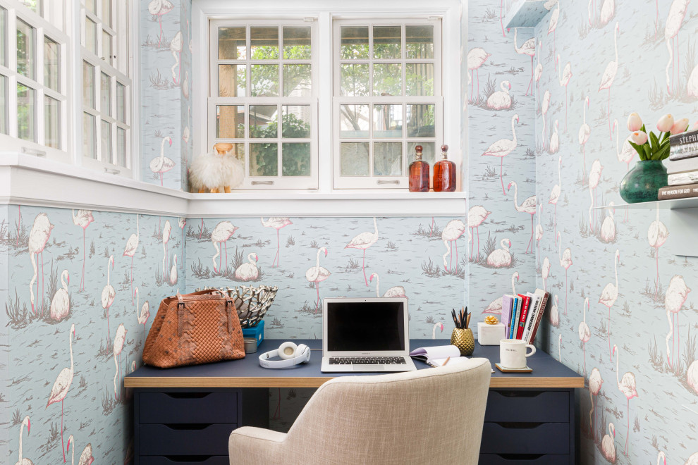 Design ideas for a mid-sized eclectic home office in New York with blue walls, medium hardwood floors, a standard fireplace and brown floor.