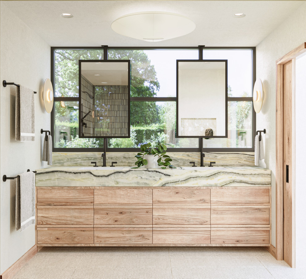 Large scandinavian master bathroom in Los Angeles with furniture-like cabinets, light wood cabinets, an open shower, a wall-mount toilet, green tile, ceramic tile, white walls, limestone floors, an undermount sink, onyx benchtops, white floor, an open shower, green benchtops, a niche, a double vanity, a floating vanity and a freestanding tub.