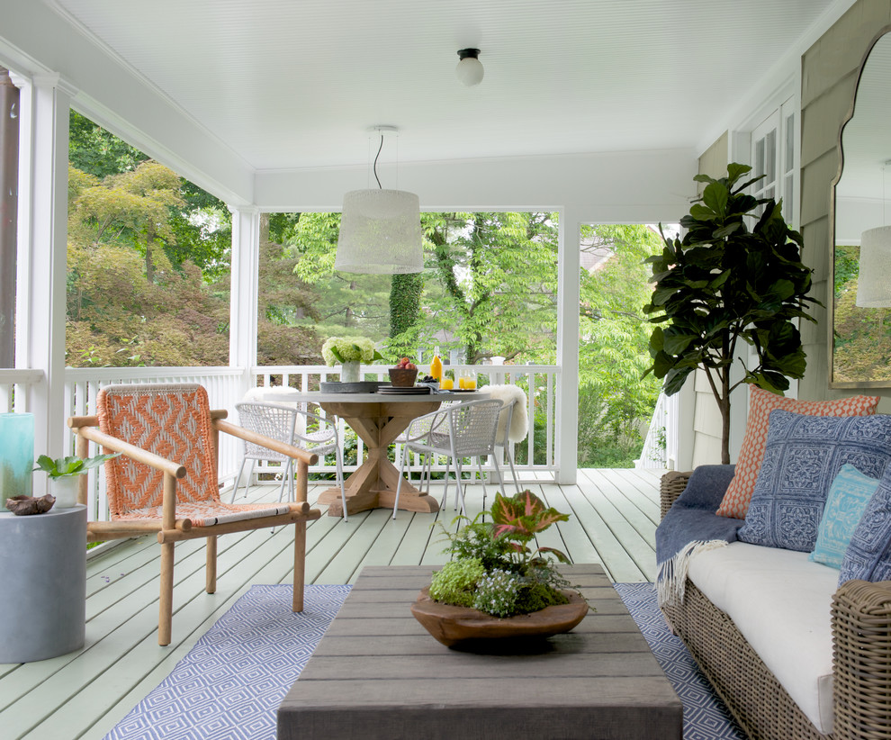 Inspiration for a mid-sized transitional backyard verandah in New York with decking and a roof extension.