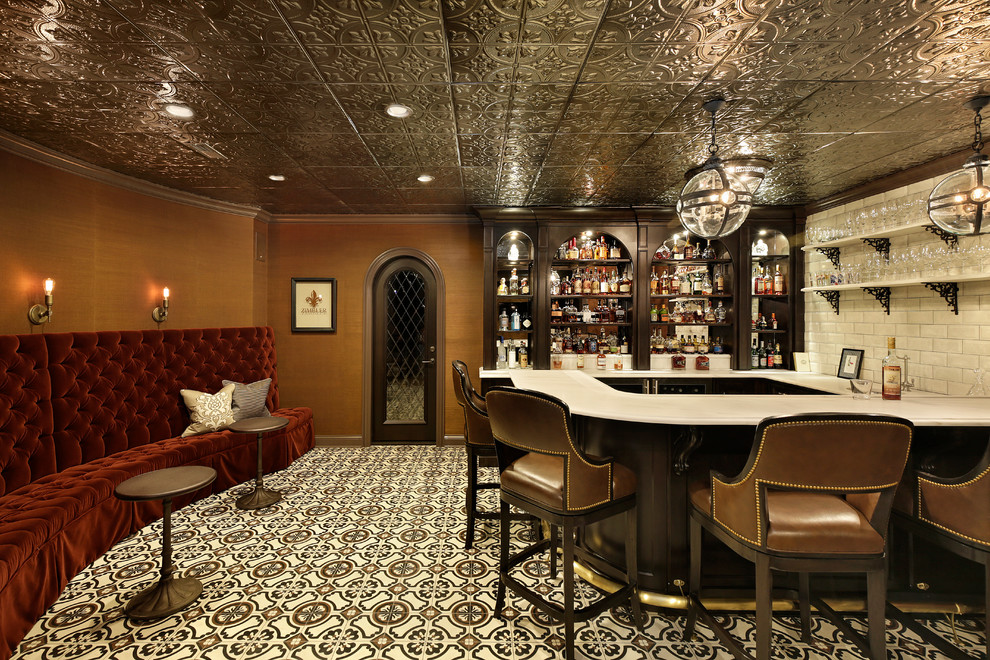 Traditional u-shaped seated home bar in Chicago with dark wood cabinets, beige splashback, ceramic splashback, ceramic floors and multi-coloured floor.
