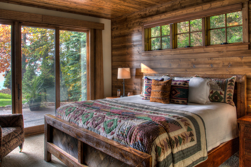 Inspiration for a mid-sized rustic guest carpeted and beige floor bedroom remodel in Minneapolis with white walls