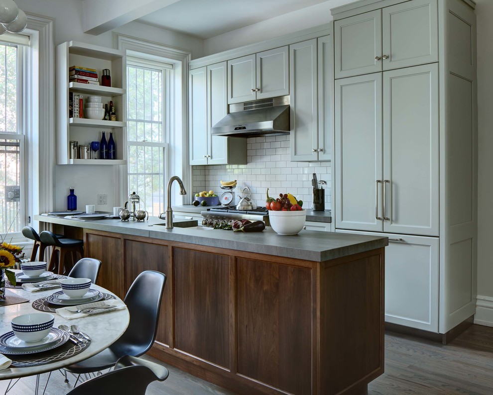 Eat-in kitchen - large transitional galley eat-in kitchen idea in New York with a single-bowl sink, white backsplash and colored appliances