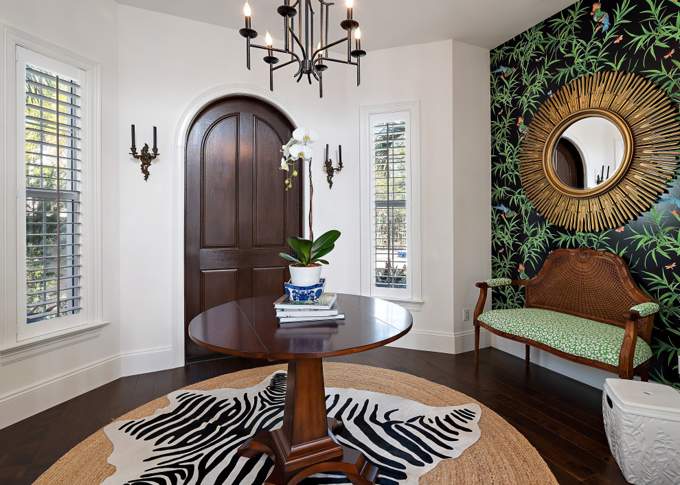 Example of a mid-sized transitional dark wood floor, brown floor and wallpaper foyer design in Miami with white walls and a medium wood front door
