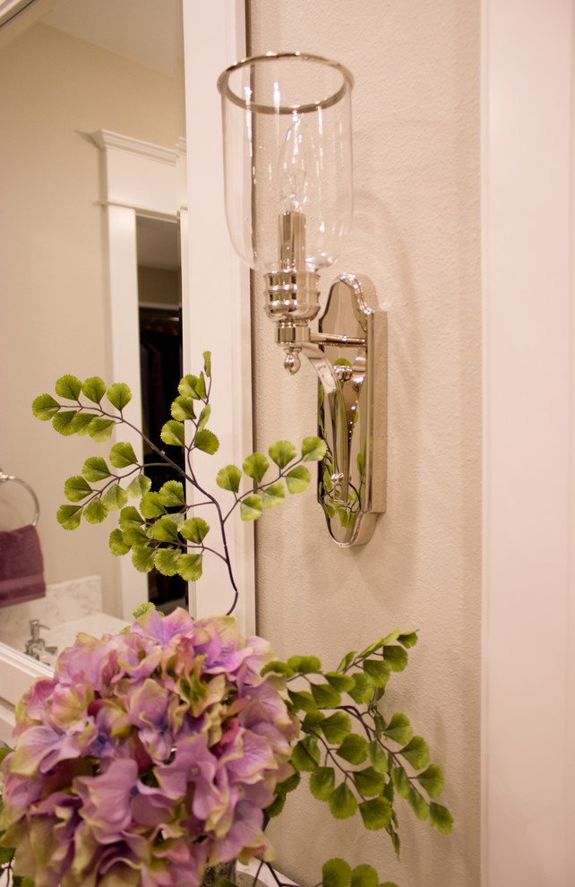 Example of a transitional bathroom design in Cedar Rapids with quartz countertops