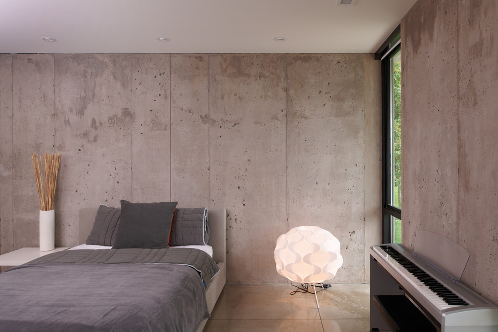 Photo of a modern bedroom in Minneapolis with concrete floors.
