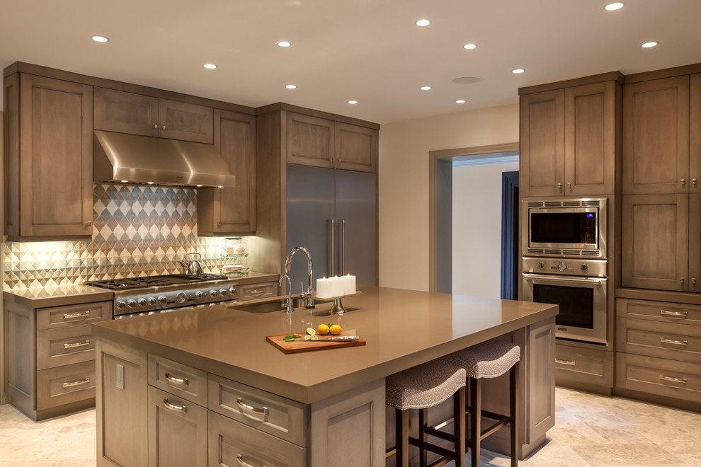 Eat-in kitchen - large transitional eat-in kitchen idea in Houston with a double-bowl sink, recessed-panel cabinets, medium tone wood cabinets, granite countertops, multicolored backsplash, stainless steel appliances and an island