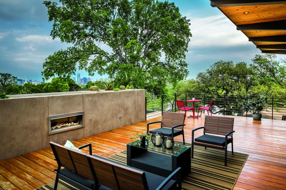 This is an example of a contemporary rooftop and rooftop deck in Charlotte with a fire feature and a roof extension.