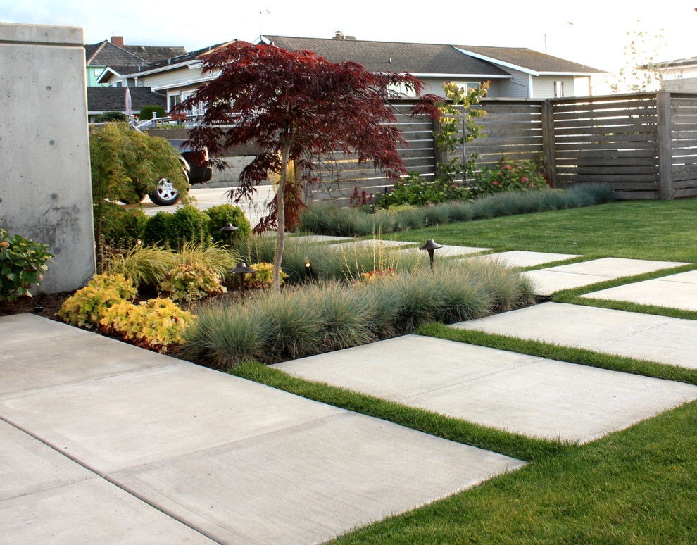 Mid-sized contemporary front yard full sun formal garden in Seattle with a garden path and concrete pavers.