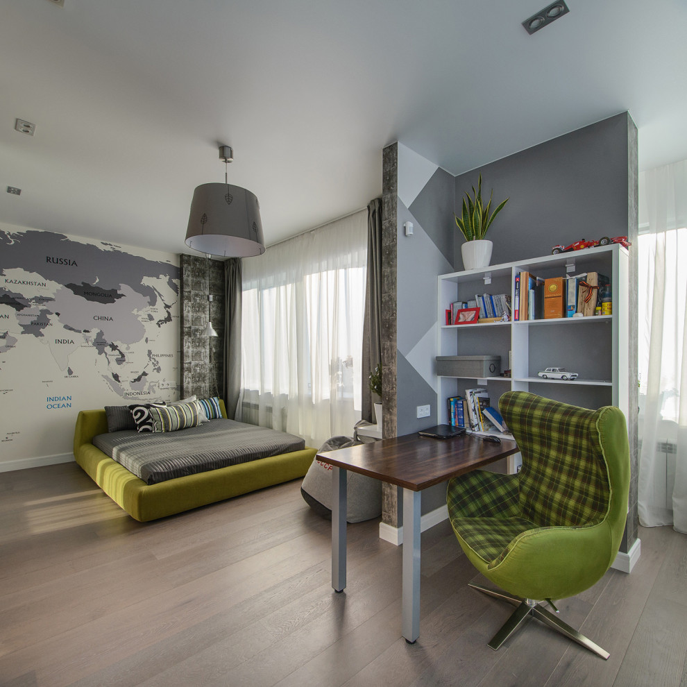This is an example of a large contemporary kids' room for boys in Novosibirsk with grey walls and brown floor.