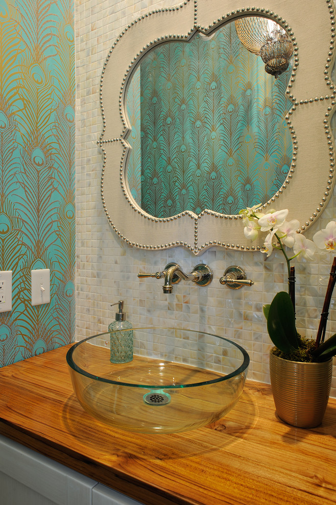 Beach style powder room in Philadelphia with a vessel sink, wood benchtops, multi-coloured tile, mosaic tile, multi-coloured walls and brown benchtops.