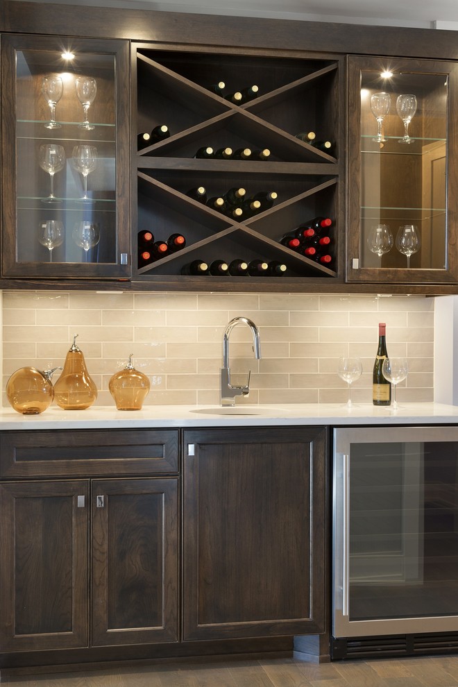 Small transitional single-wall wet bar in Minneapolis with an undermount sink, shaker cabinets, dark wood cabinets, quartzite benchtops, beige splashback, subway tile splashback and slate floors.