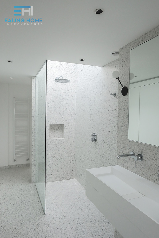 Photo of a modern bathroom in London with an open shower, terrazzo floors and an open shower.