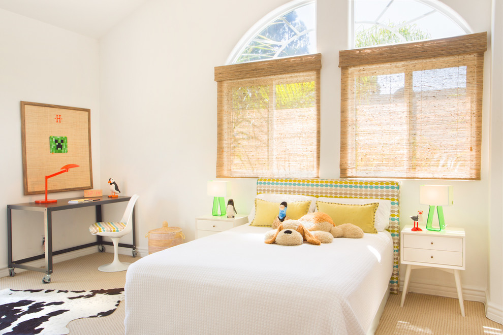 Photo of a beach style kids' bedroom for kids 4-10 years old and girls in Los Angeles with white walls and carpet.