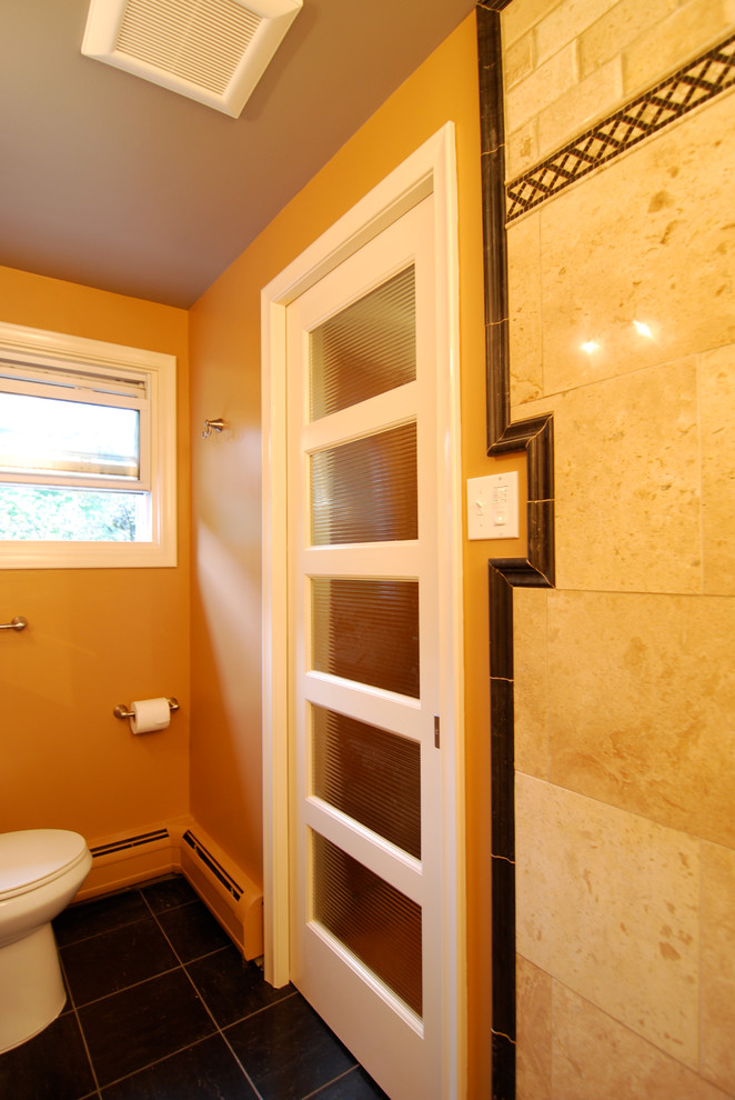 This is an example of a small modern master bathroom in Detroit with an alcove shower, brown tile, porcelain tile, orange walls and slate floors.