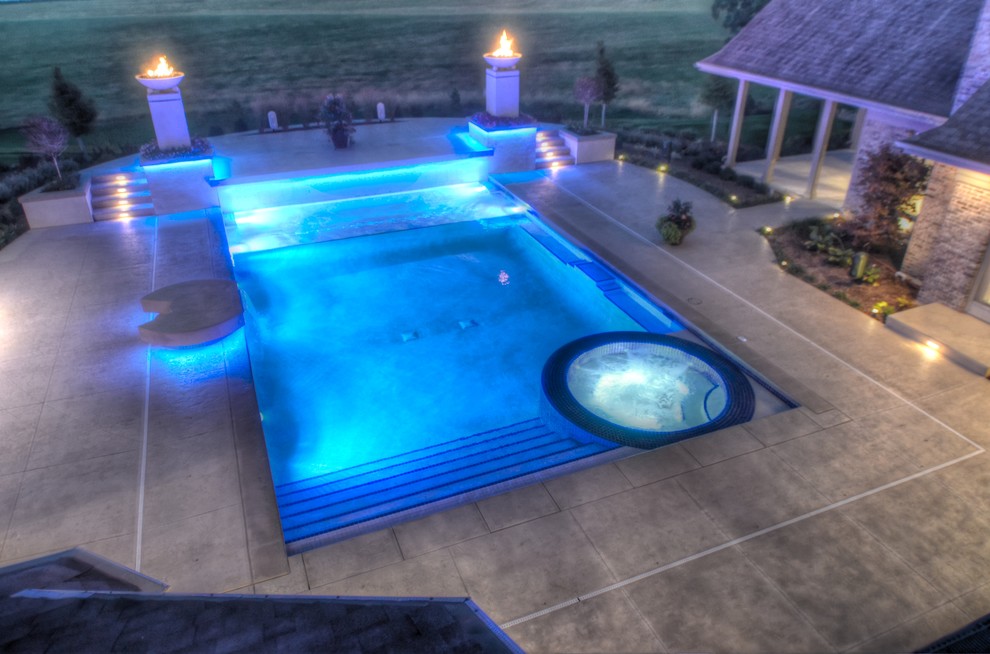Hot tub - large transitional backyard concrete paver and rectangular natural hot tub idea in Cedar Rapids