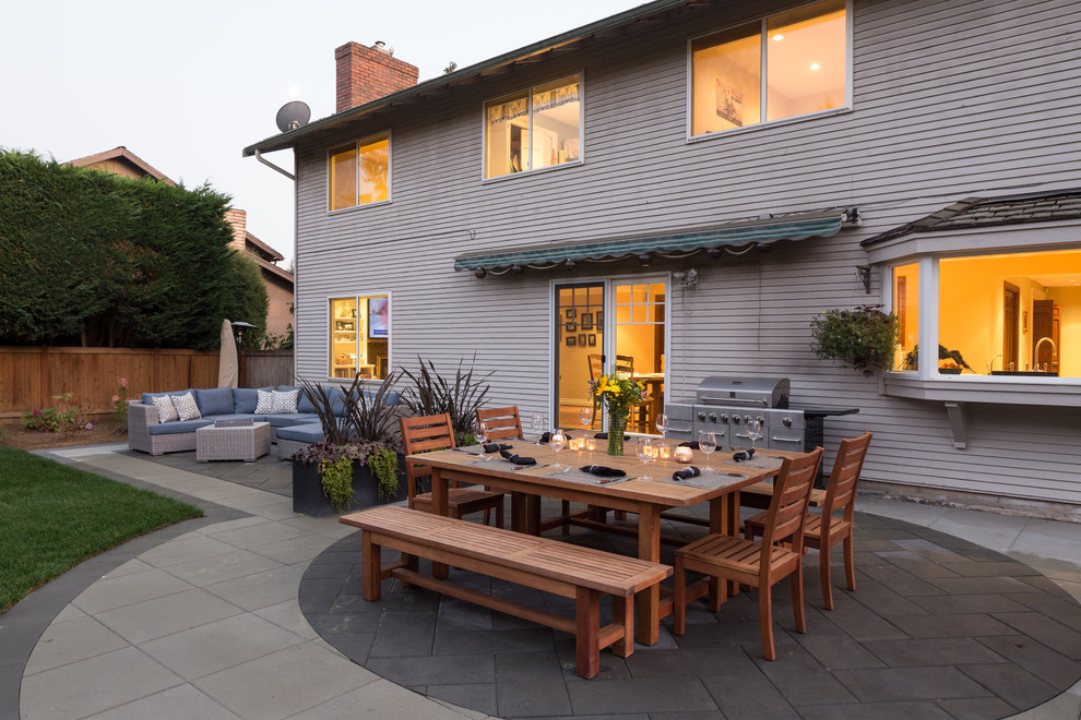 Photo of an expansive contemporary backyard patio in Seattle with a fire feature, concrete pavers and no cover.