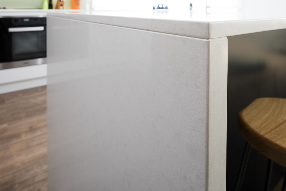 Design ideas for a modern kitchen in Perth with quartz benchtops and white benchtop.