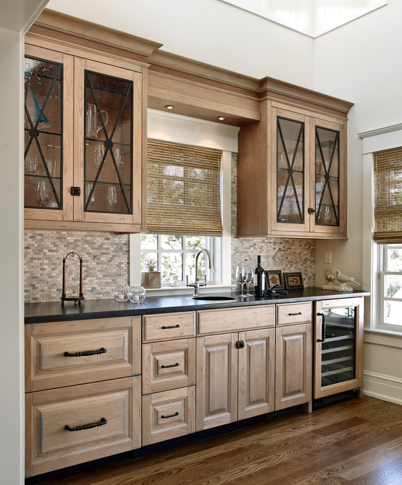 Design ideas for a traditional single-wall eat-in kitchen in Philadelphia with an integrated sink, raised-panel cabinets, medium wood cabinets and beige splashback.