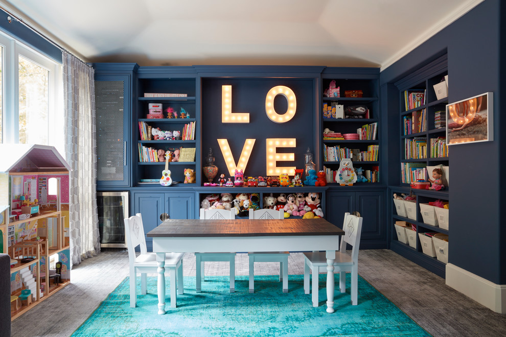 Photo of a transitional kids' playroom for girls in Los Angeles with blue walls, carpet and grey floor.