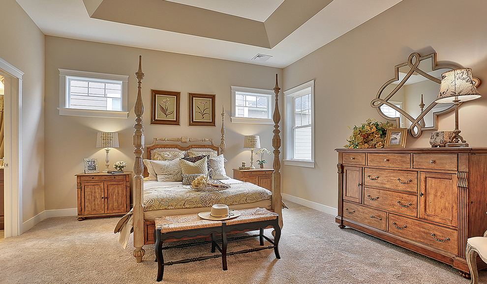 This is an example of a mid-sized transitional master bedroom in Philadelphia with beige walls, carpet and no fireplace.