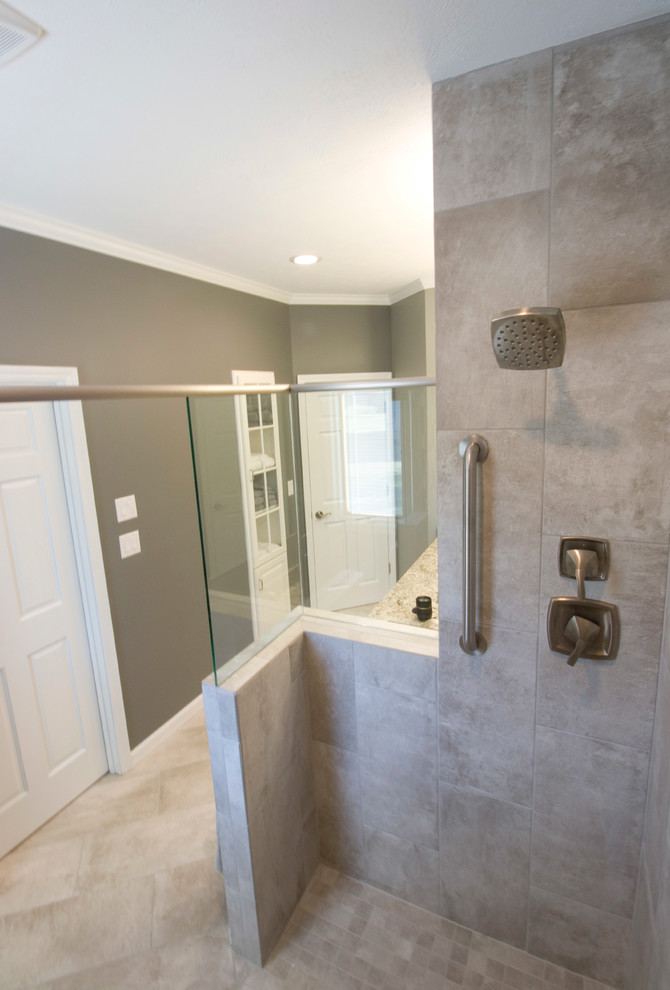 Example of a mid-sized transitional master gray tile and ceramic tile ceramic tile walk-in shower design with an undermount sink, raised-panel cabinets, white cabinets, granite countertops, a two-piece toilet and gray walls