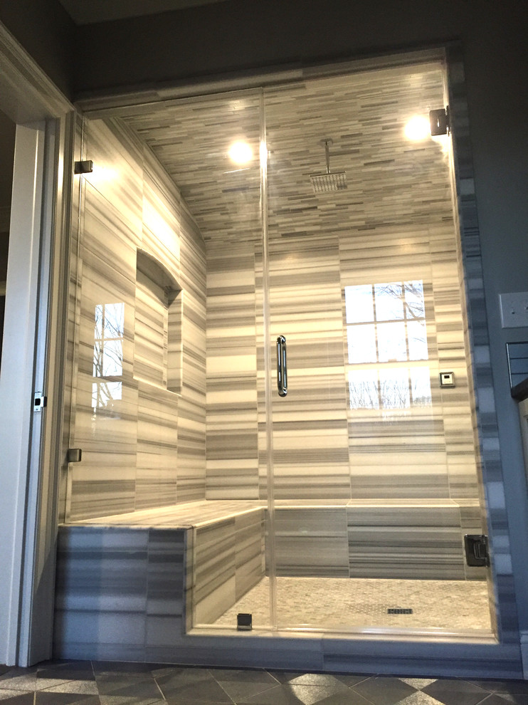 Example of a transitional gray tile and stone tile bathroom design