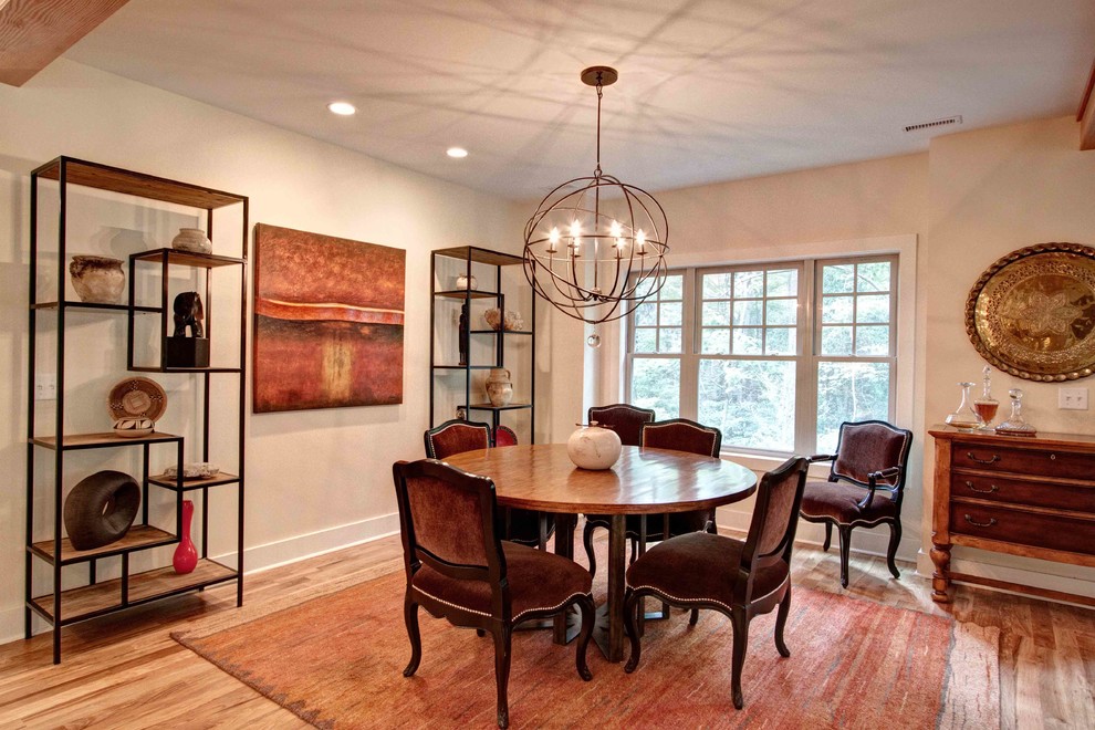 Inspiration for a transitional dining room in Other with beige walls and medium hardwood floors.