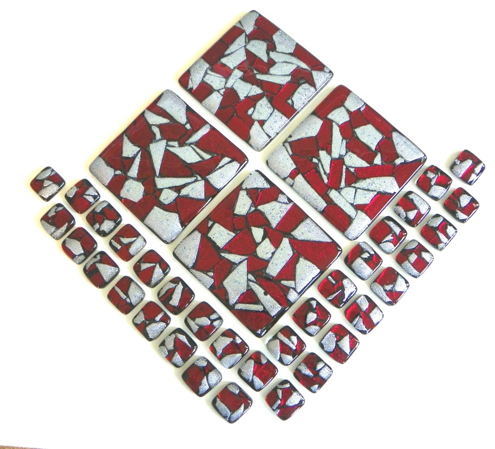 Glass accent tiles in red and silver dichroic glass.