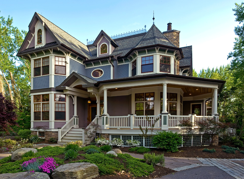 Design ideas for a large traditional two-storey purple house exterior in New York with wood siding and a gable roof.